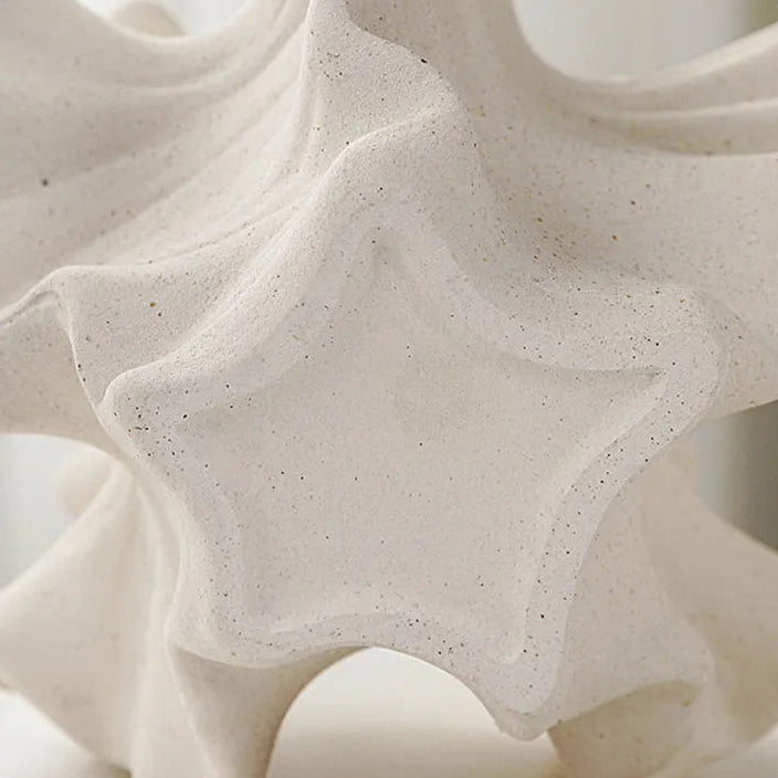 Close-up of a textured stone surface with a smooth bottom.