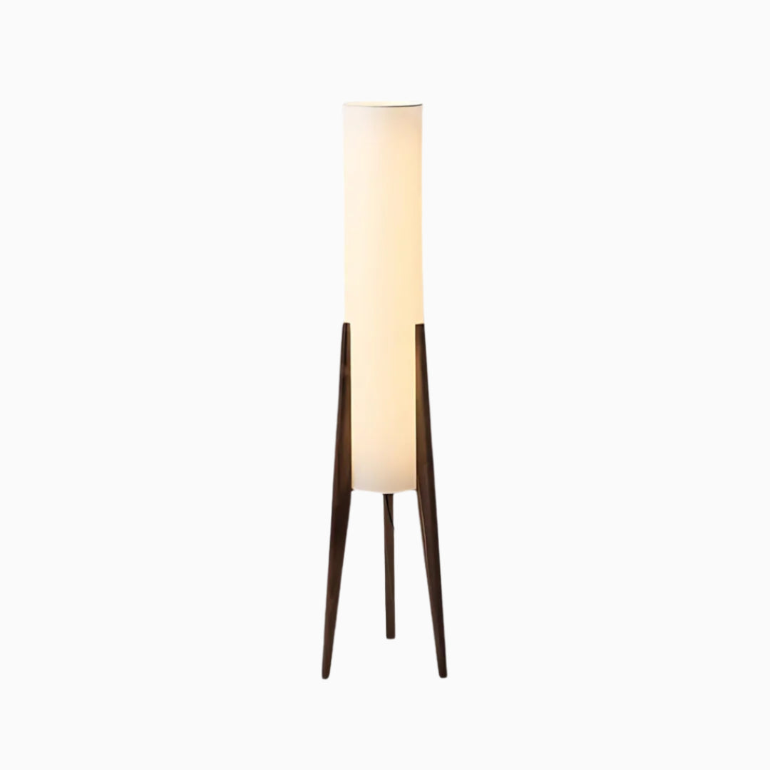 A tall, slender floor lamp with a brown wood base and a white fabric shade, designed in a modern style.