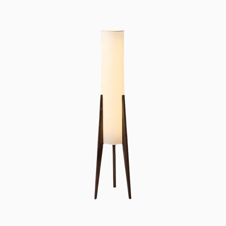 A tall, slender floor lamp with a brown wood base and a white fabric shade, designed in a modern style.